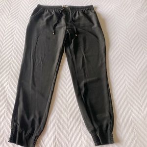 Dressy silk like jogger black pants. Size large. Marilyn Monroe. Super cute!